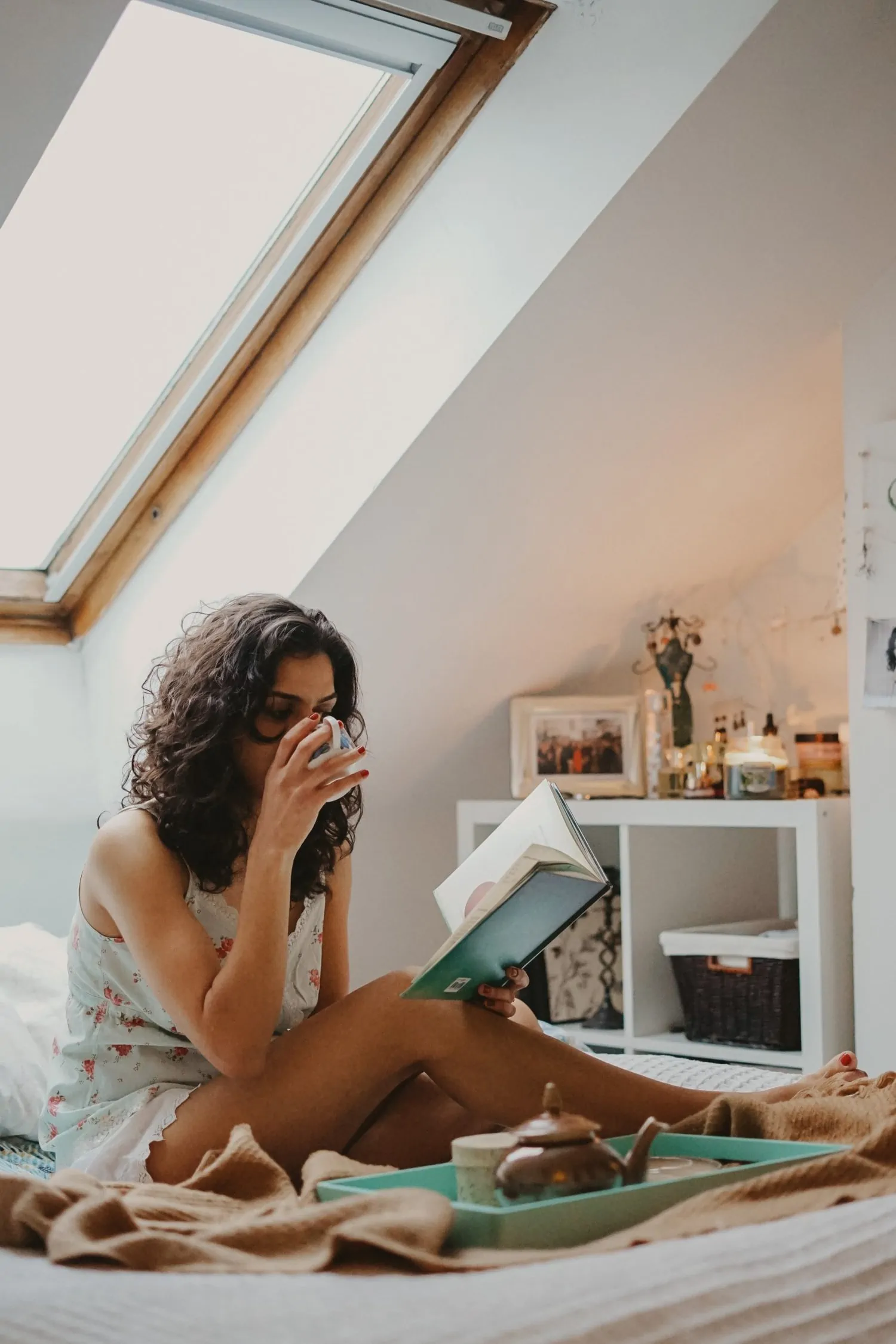 Woman reading her book and taking care of herself to heal from childhood trauma