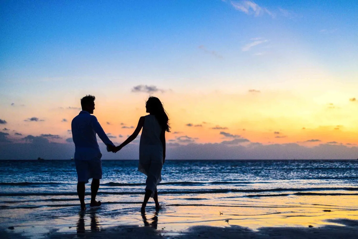 Couple on the beach during sunset